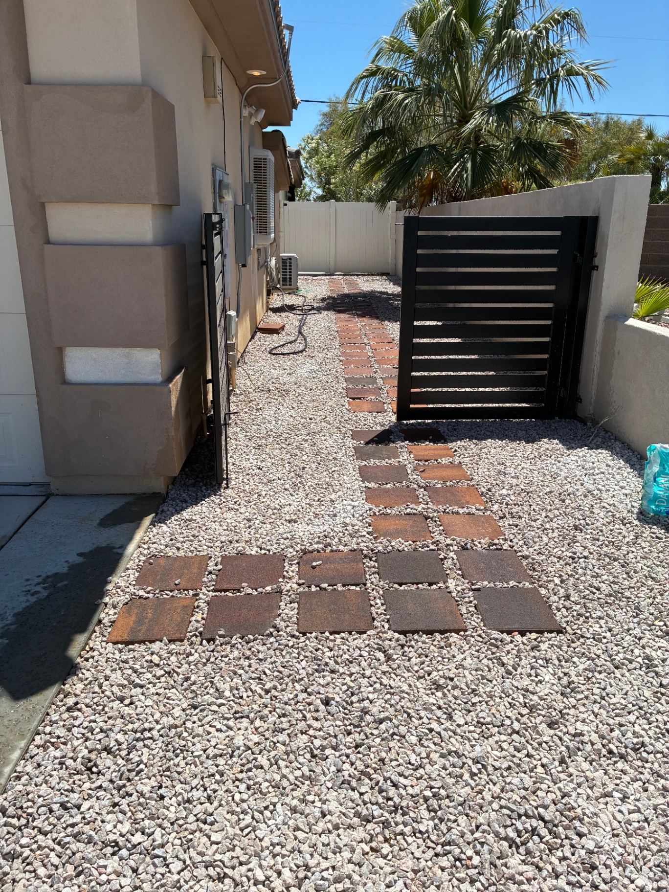 Side yard hardscape path with stepping stones and gate